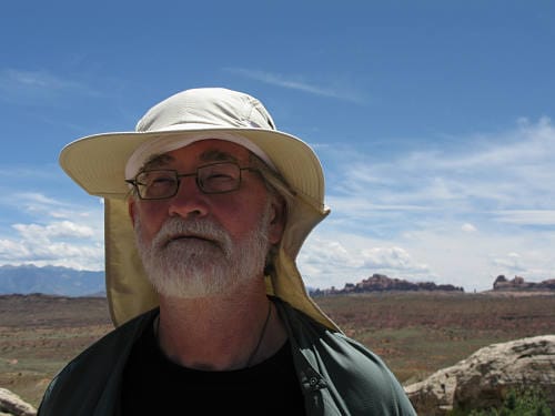 Mark with his hat against a horizon in Canyonland