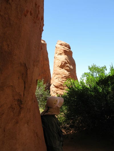 Mark viewing rock formation near Sand Dune Arch